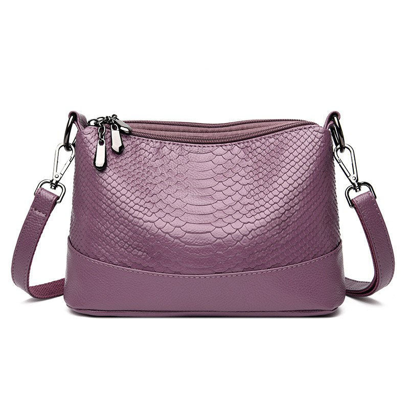 Fashionable shoulder bag with a crocodile print