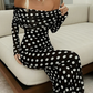 Elegant dress with polka dot pattern and bare shoulders